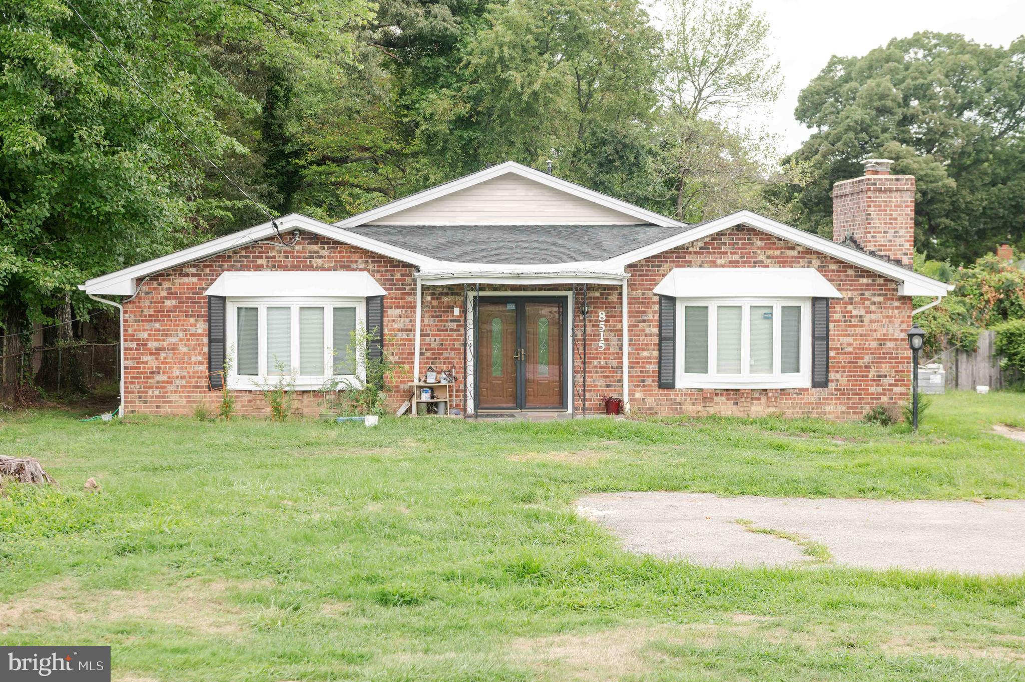 a front of a house with a garden