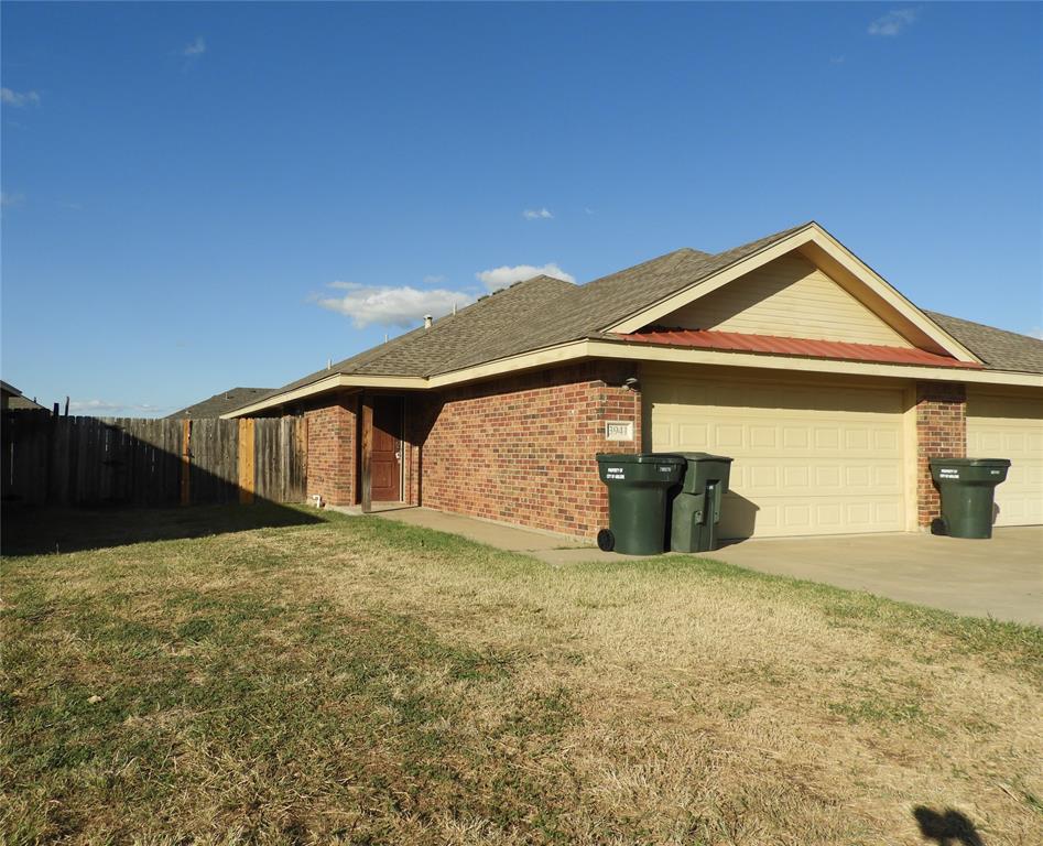 a house with yard in front of it