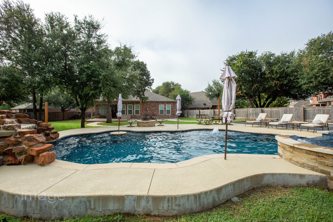 a view of a swimming pool with a patio