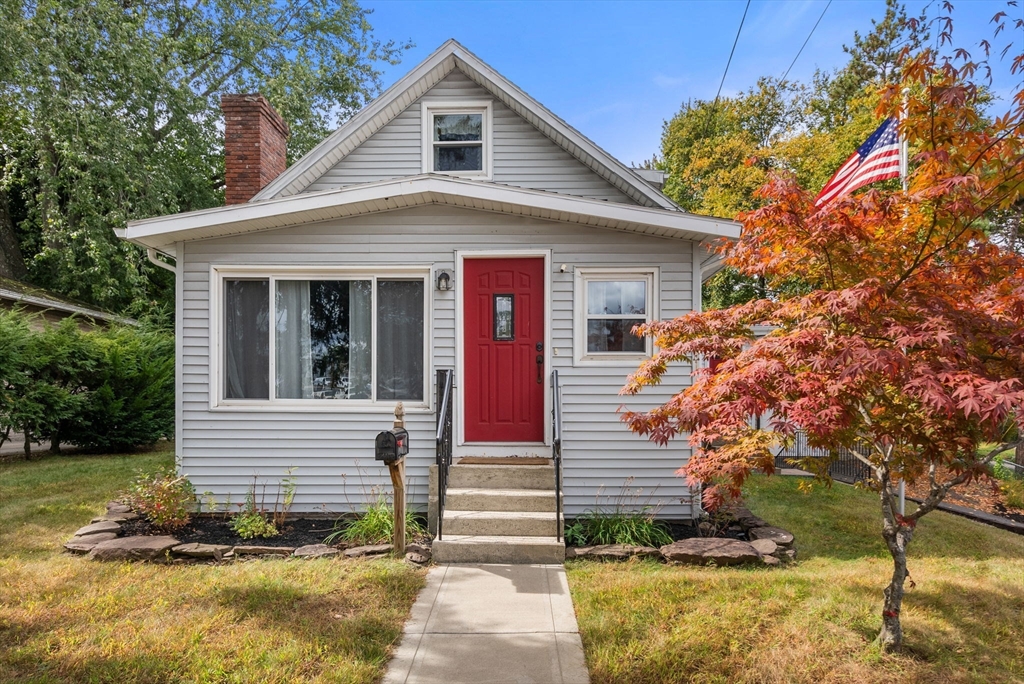 a front view of a house with a yard