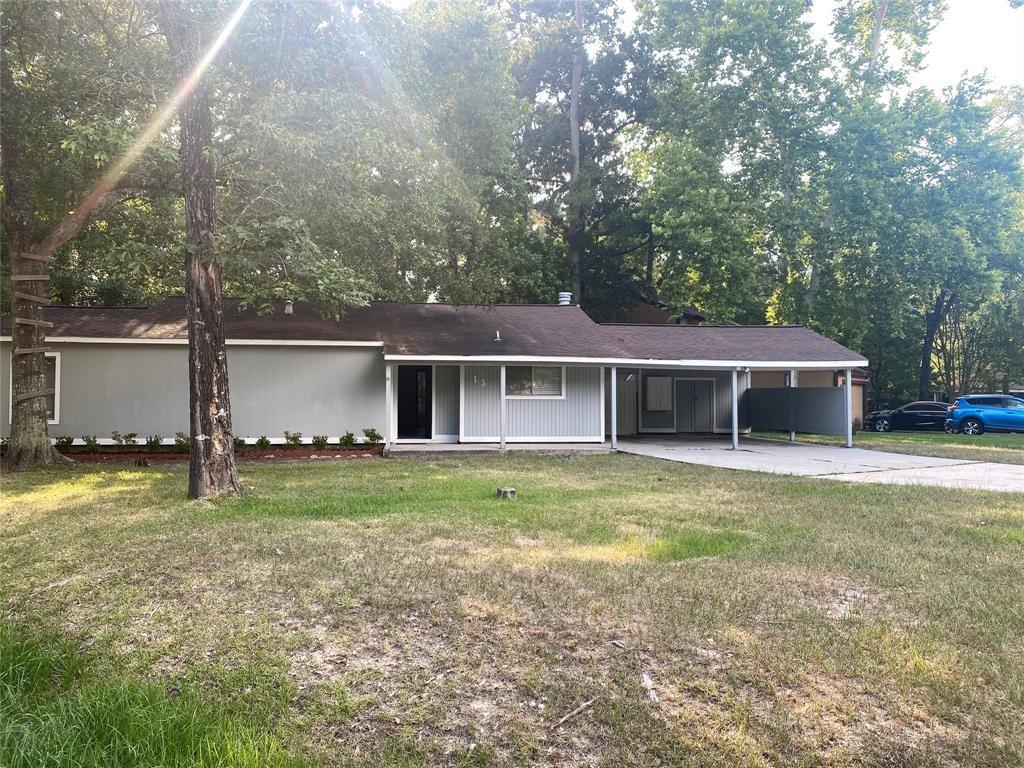 a view of a house with a backyard