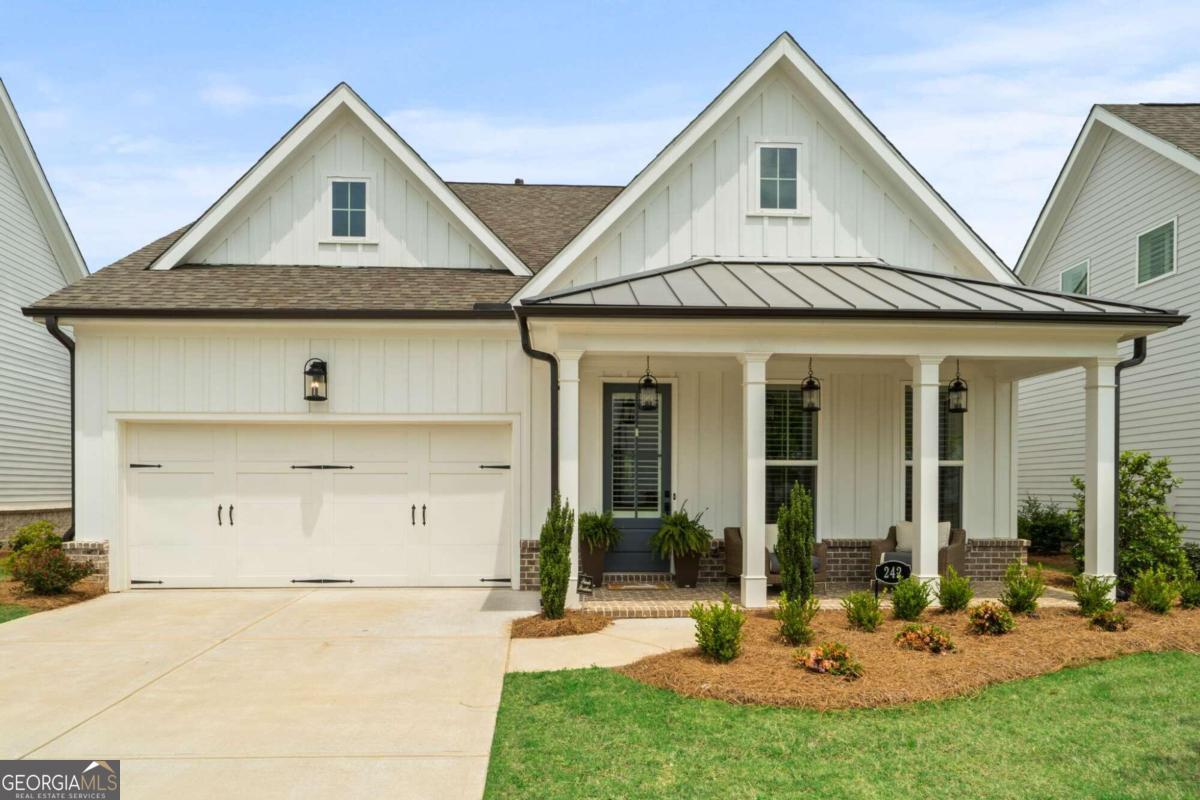 a front view of a house with garden