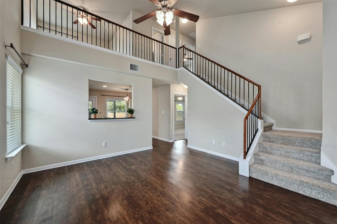 a view of staircase with white walls and a window