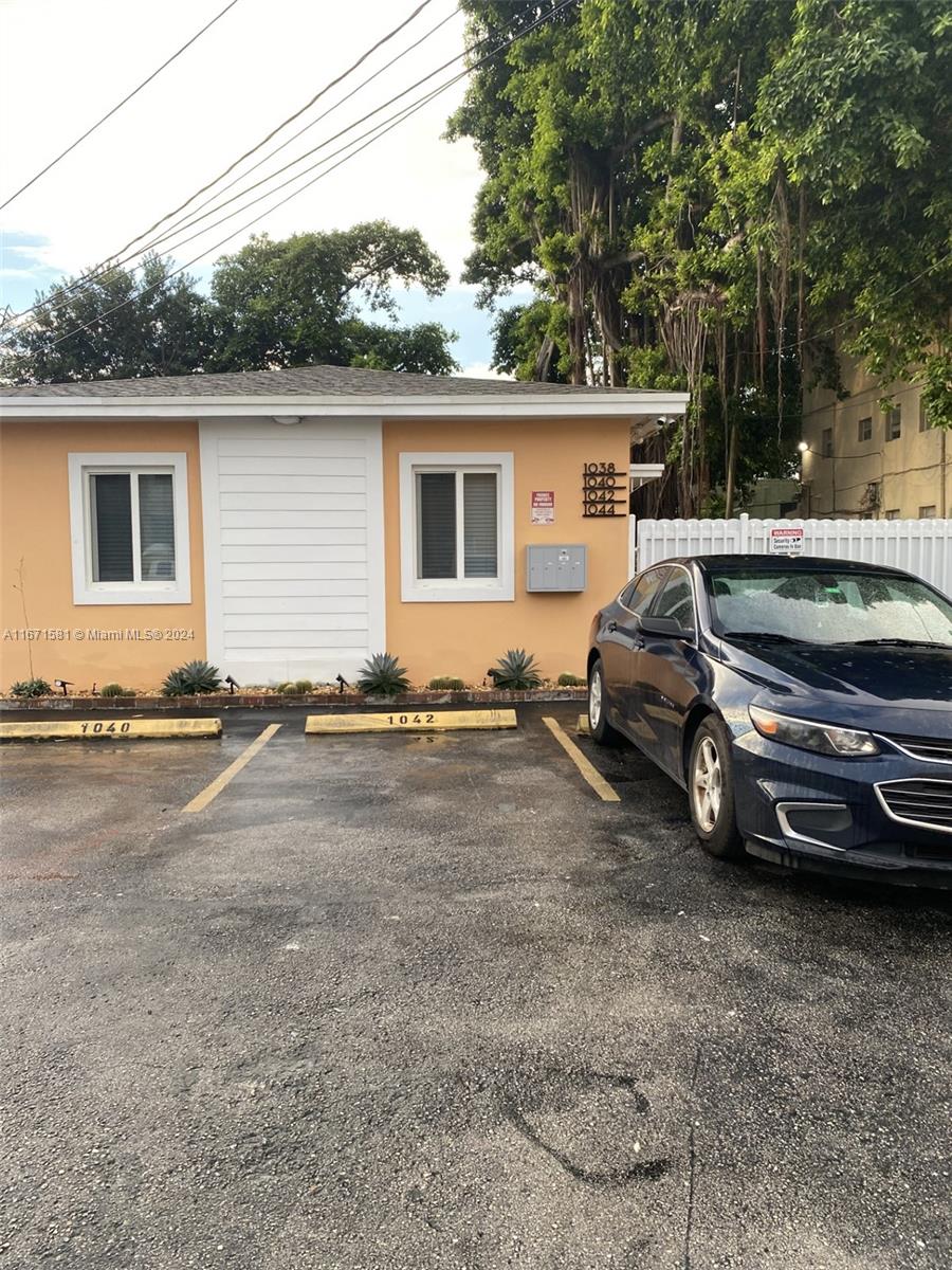 a view of a car parked in front of a house