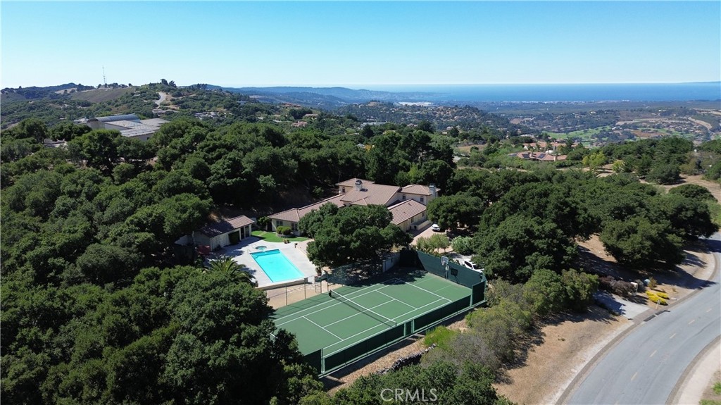 an aerial view of a house with a yard