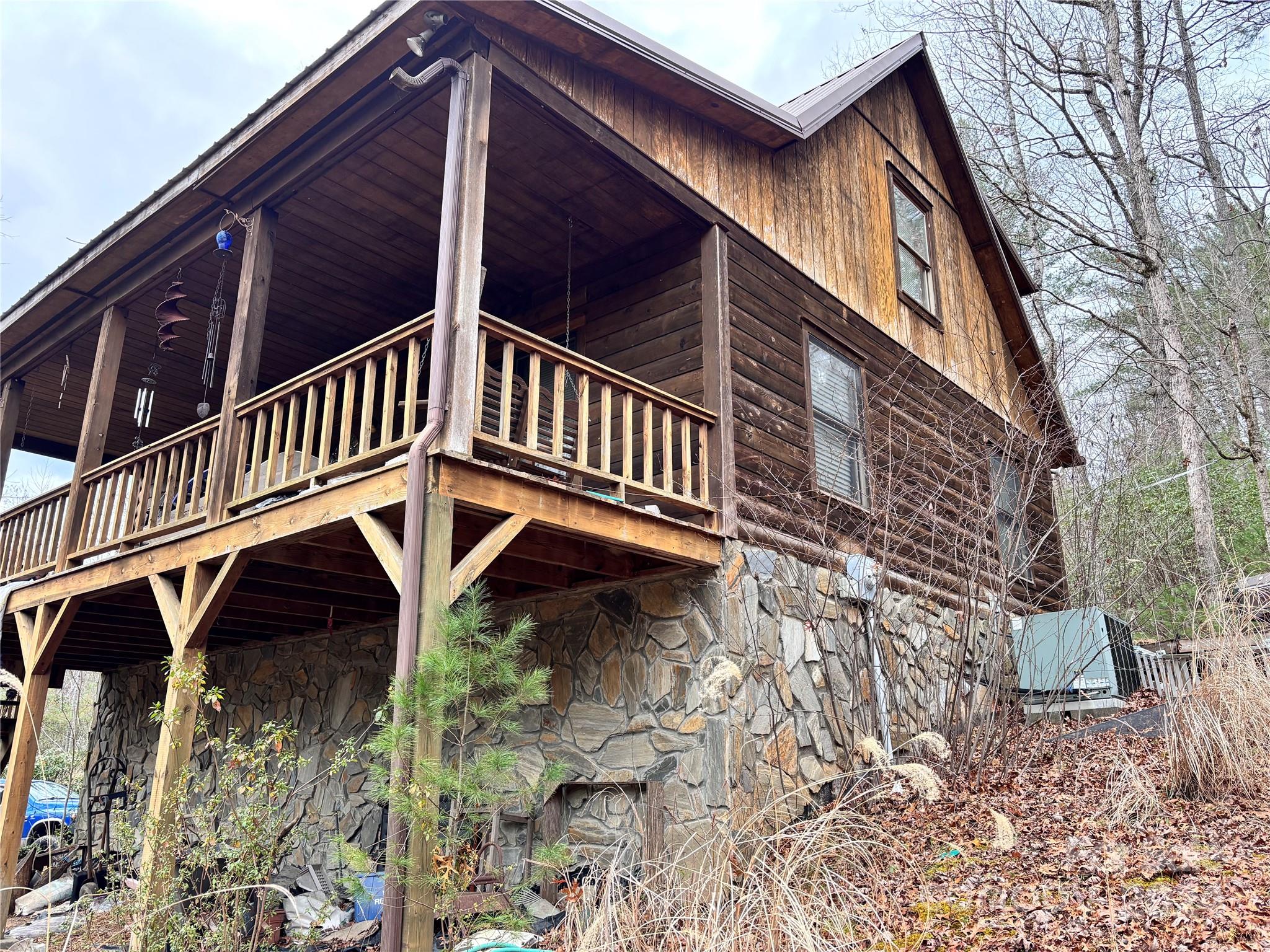 a view of balcony with small stairs and wooden floor