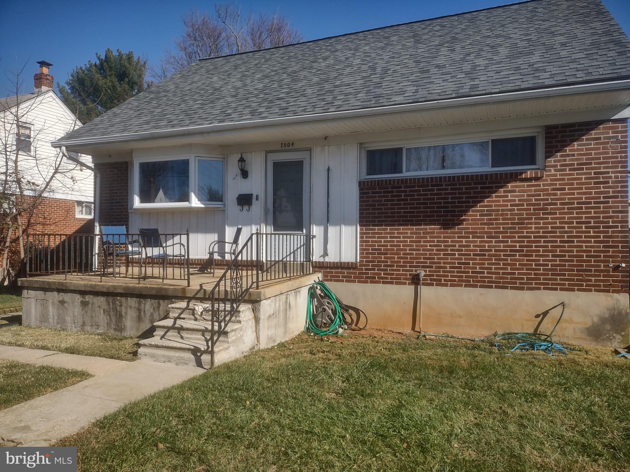 a view of house with outdoor seating