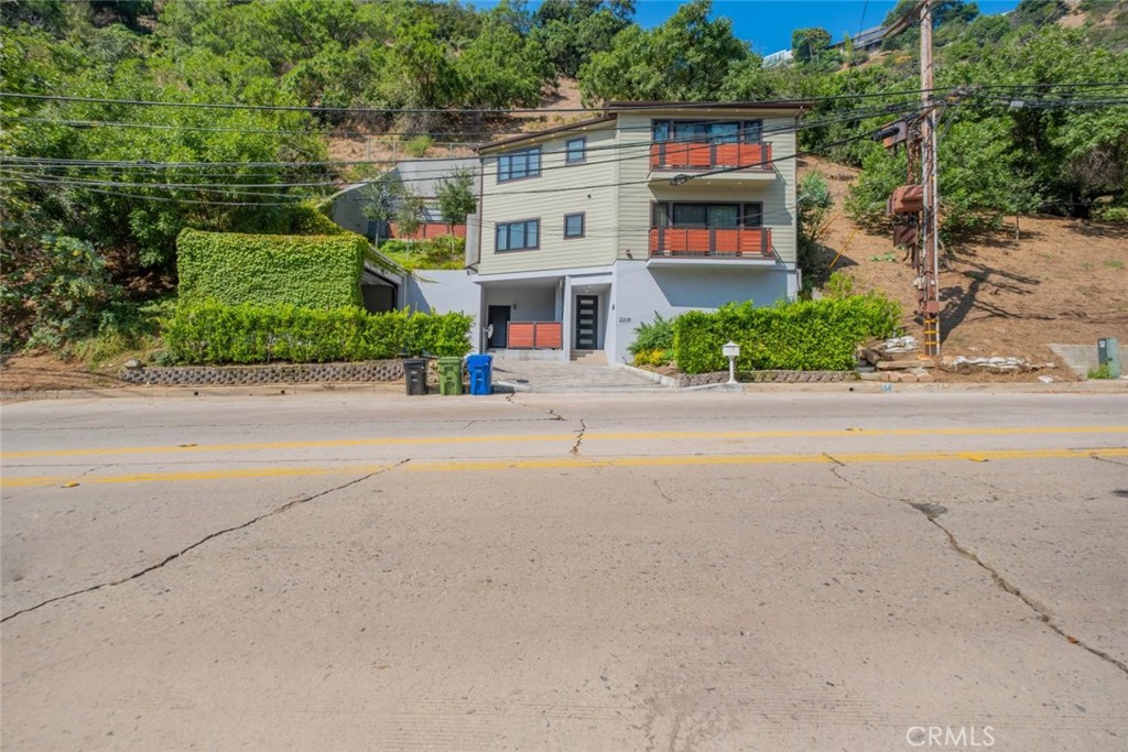 front view of house next to a road