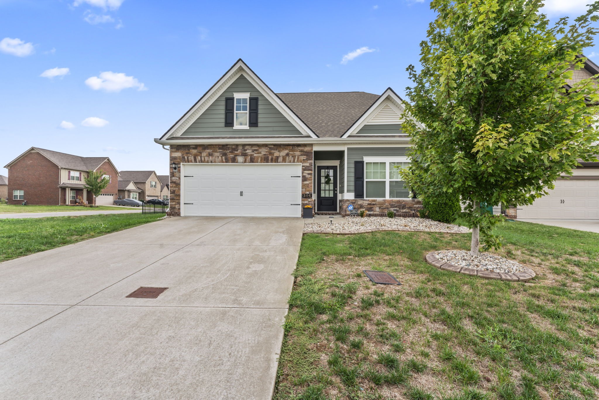 a front view of a house with a yard