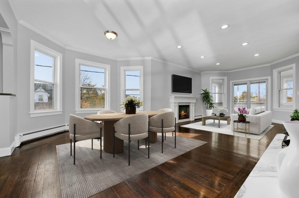 a view of a dining room with furniture window and wooden floor