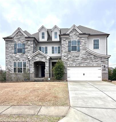 a front view of a house with yard