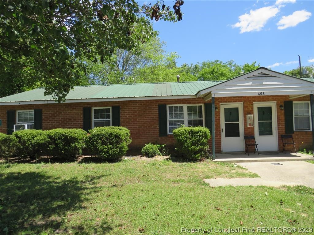 a front view of a house with a yard