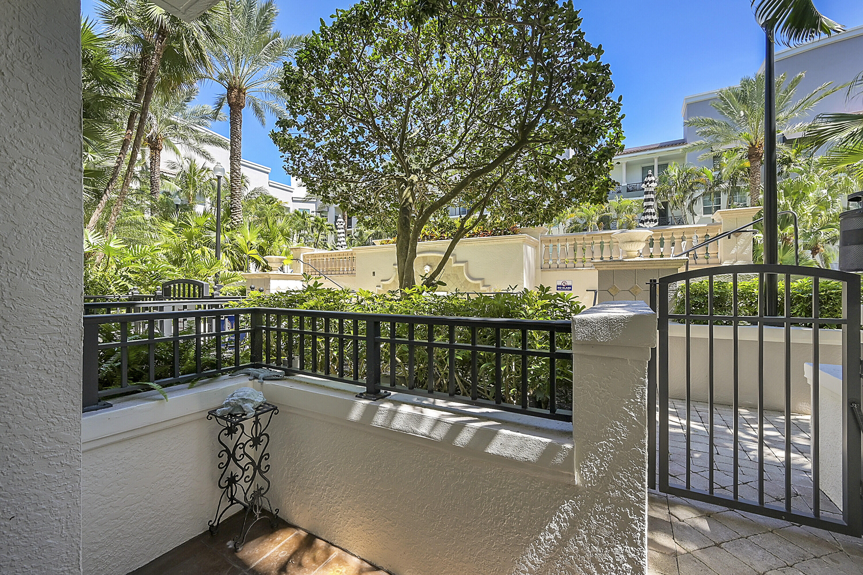 a view of a balcony with wooden floor and fence