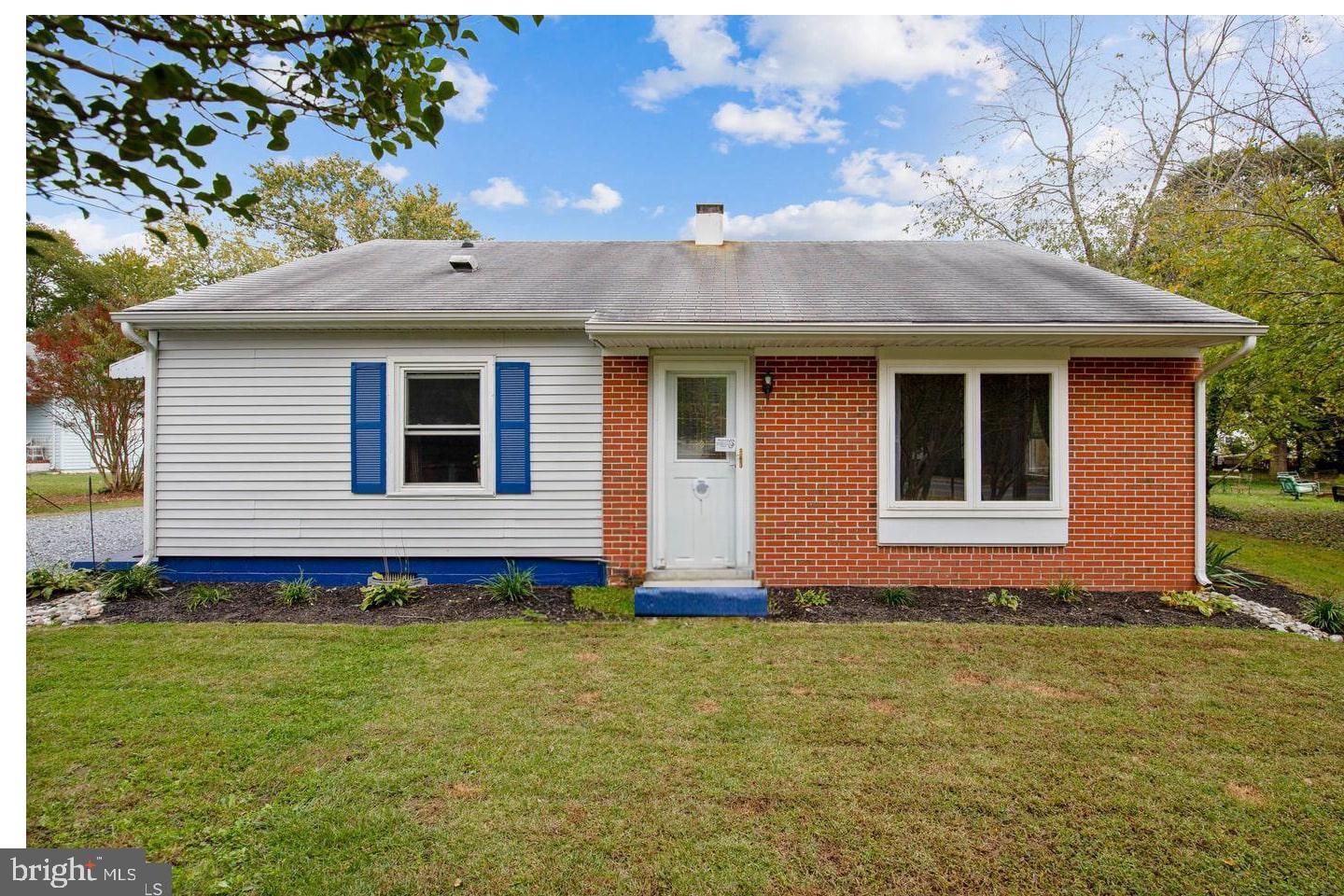 a front view of house with yard