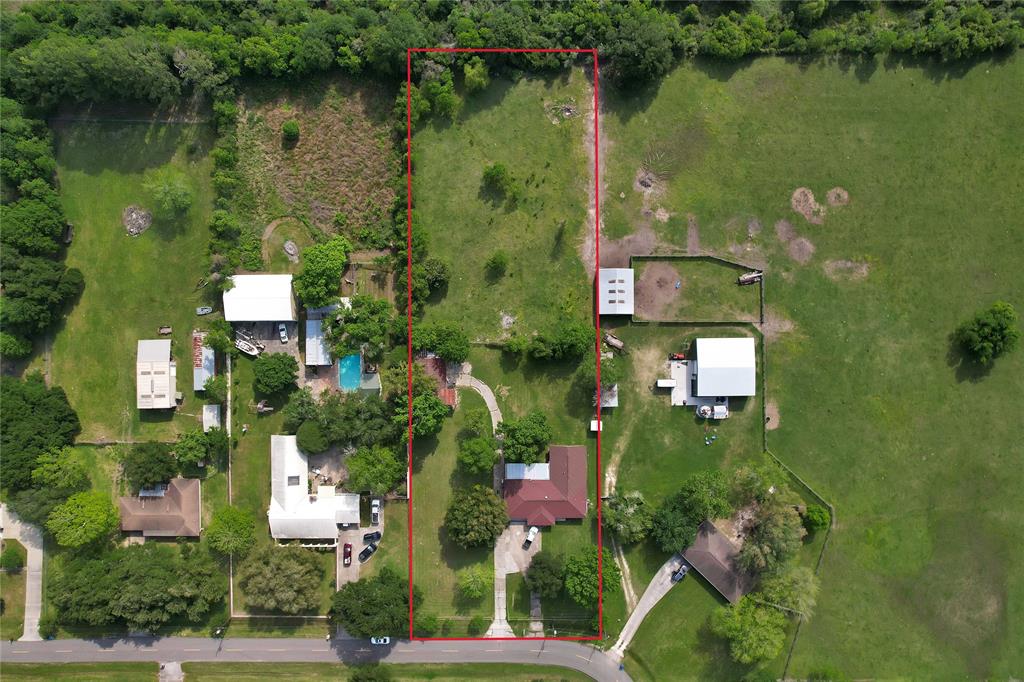 an aerial view of residential house with outdoor space and lake view