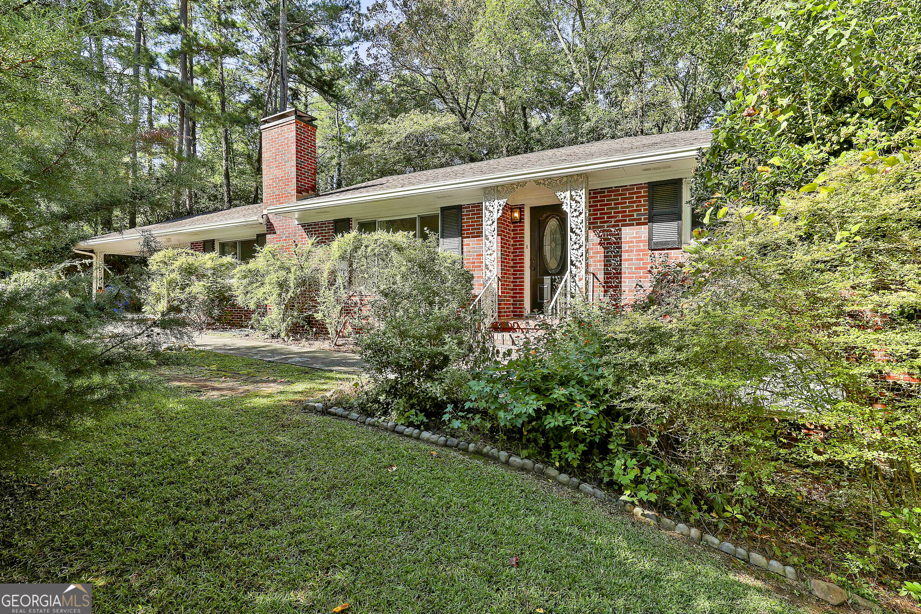 a front view of a house with garden