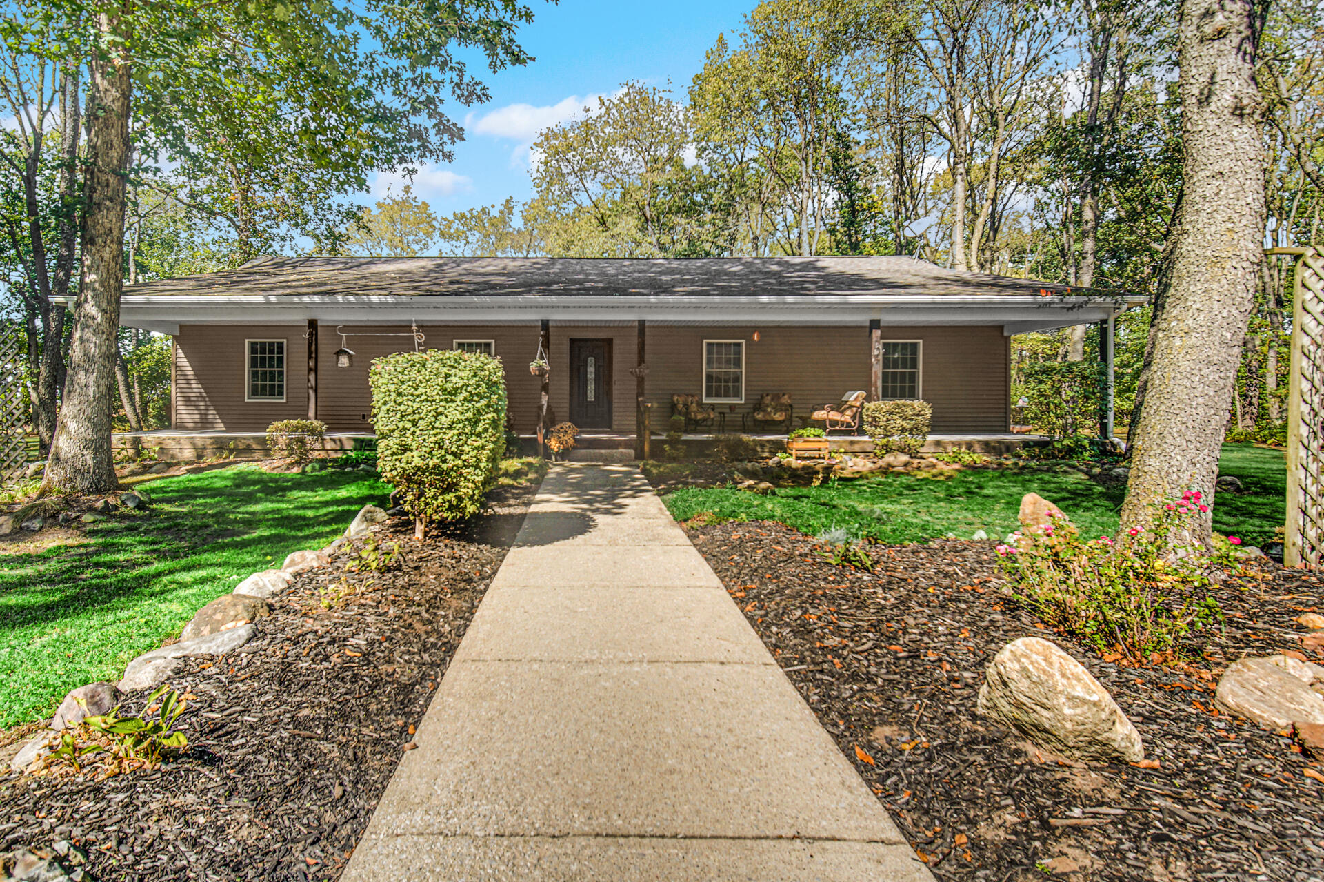 a front view of a house with garden