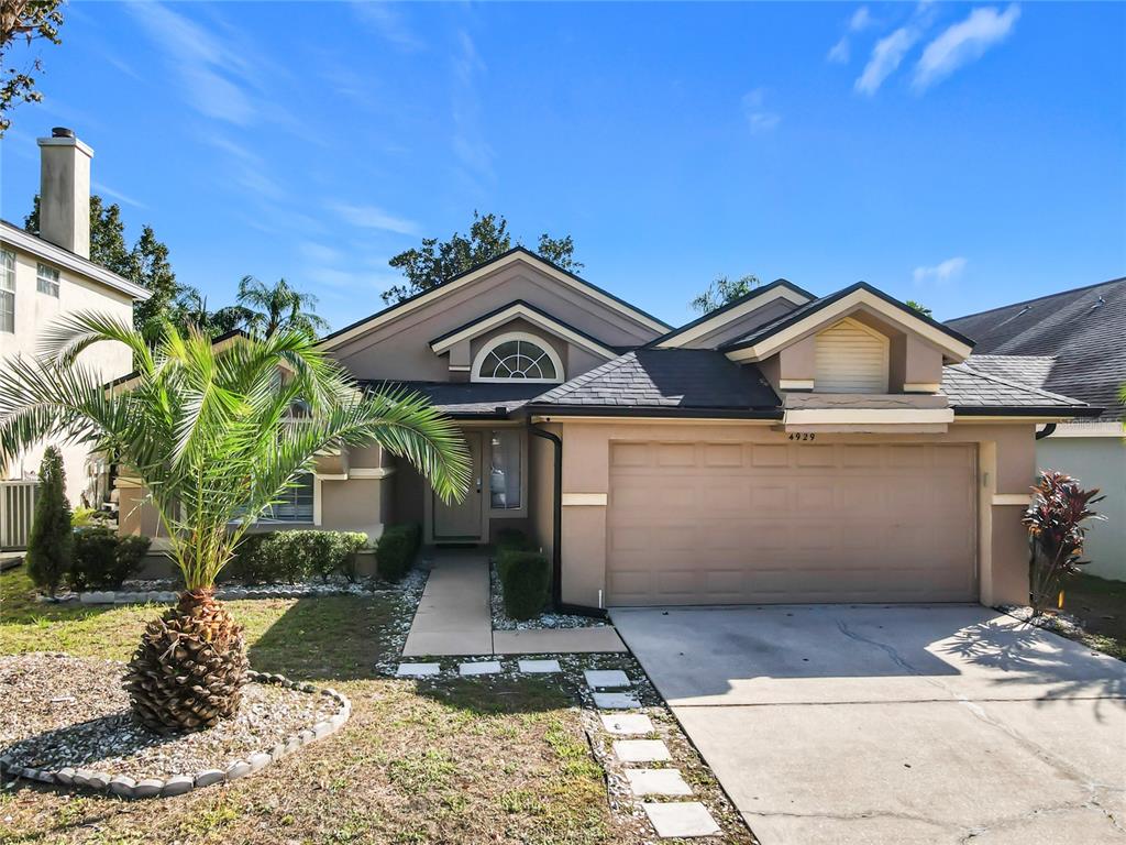 a view of a front of a house with a yard