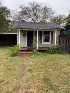 a front view of a house with yard