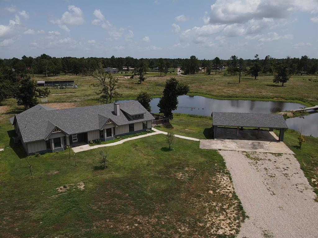 a view of a lake with a yard