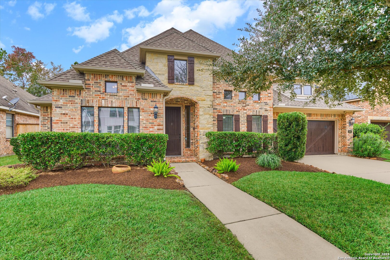 a front view of a house with a yard