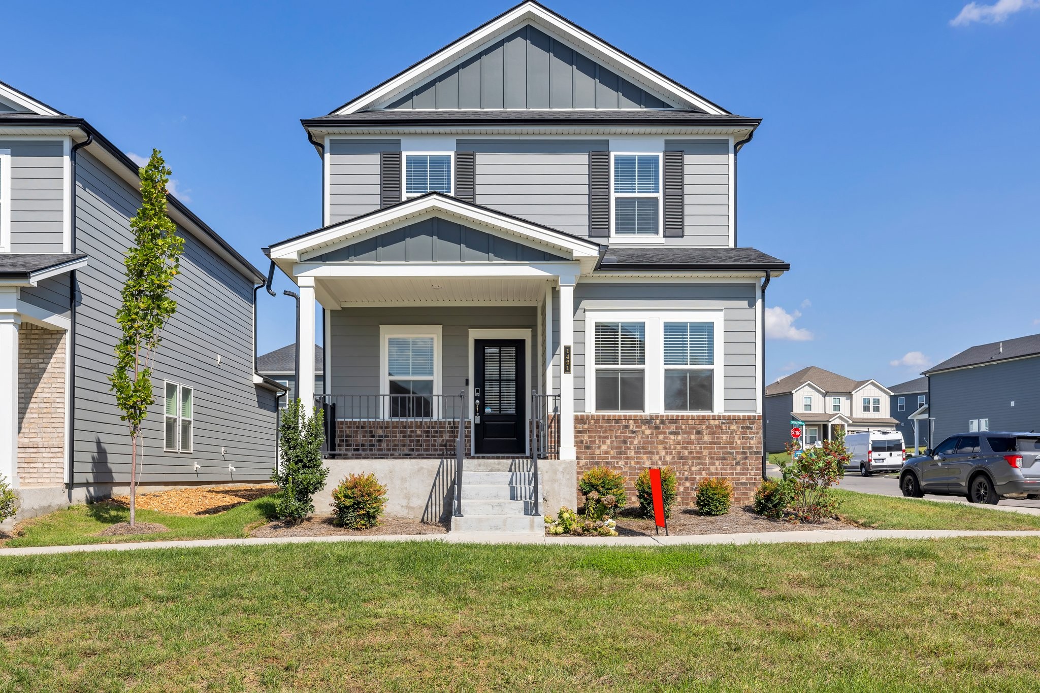 a front view of a house with a yard