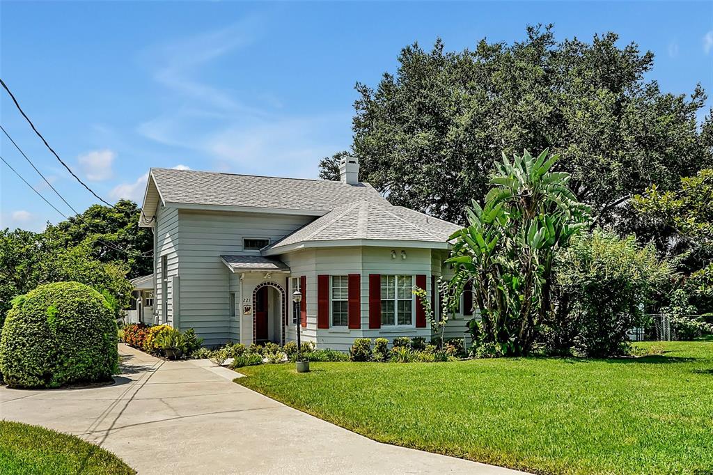 a front view of a house with garden