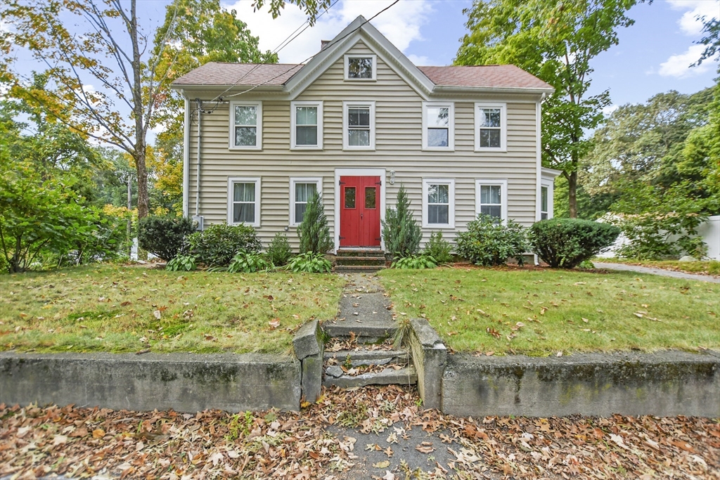 a front view of a house with a yard