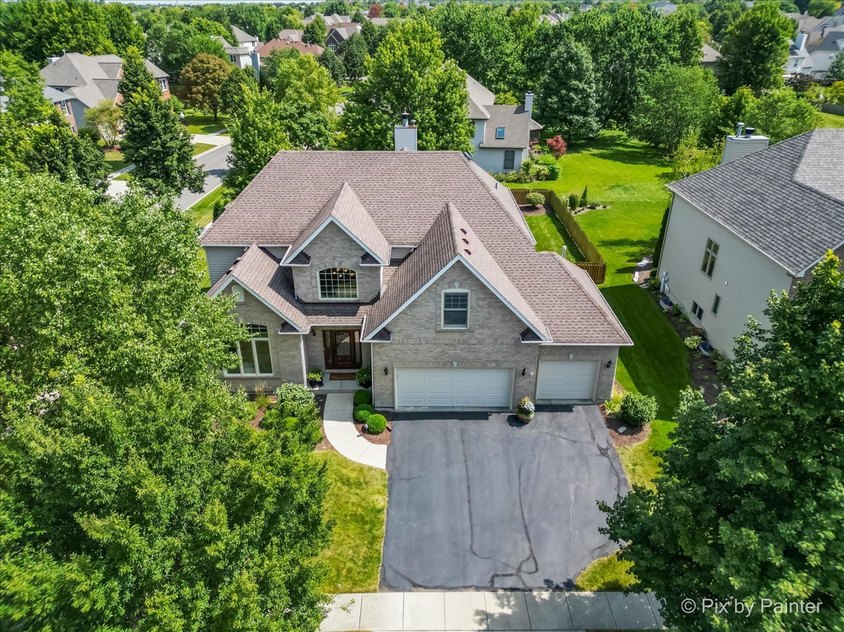 an aerial view of a house with a garden