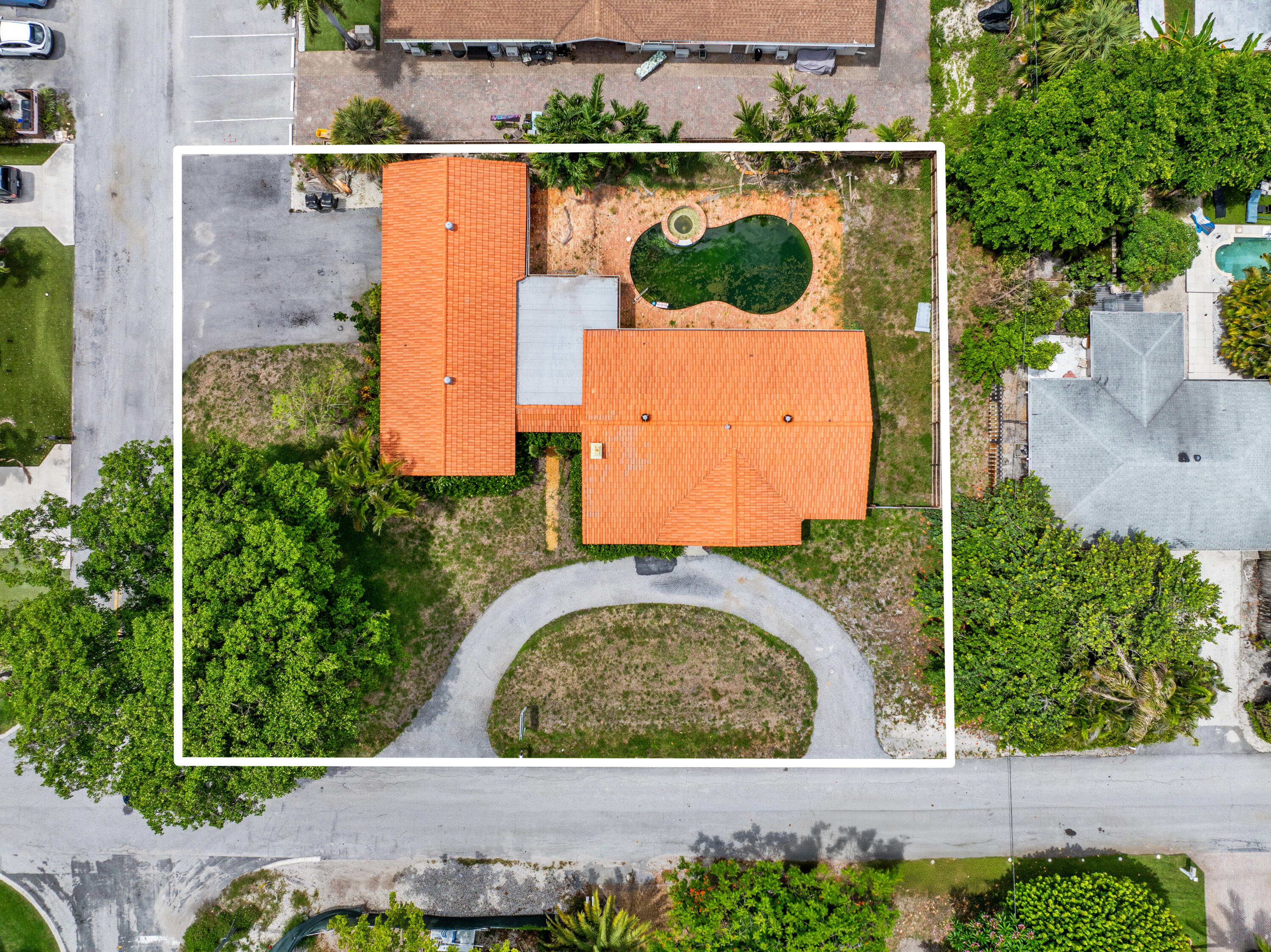 an aerial view of a house with a garden