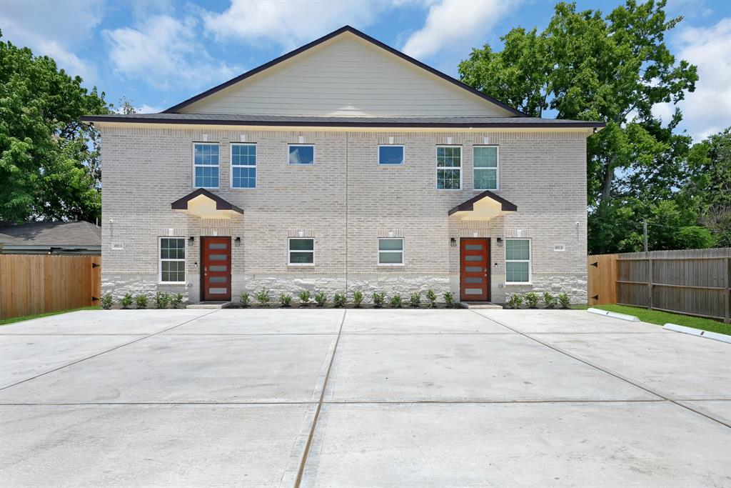 front view of duplex and private parking area