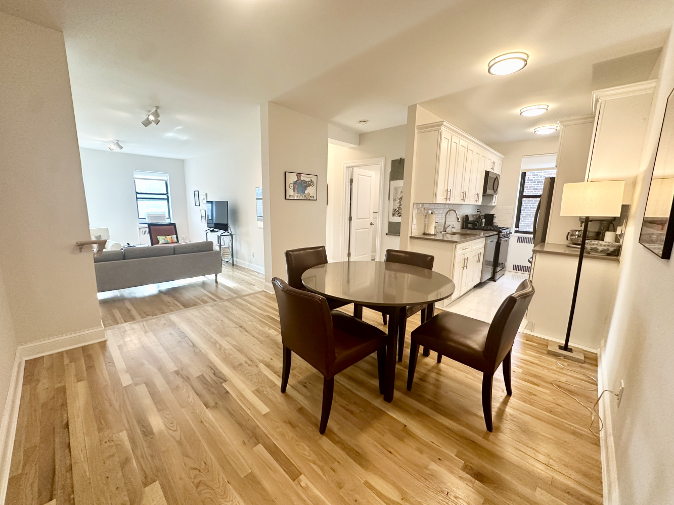 a view of a dining room with furniture and wooden floor