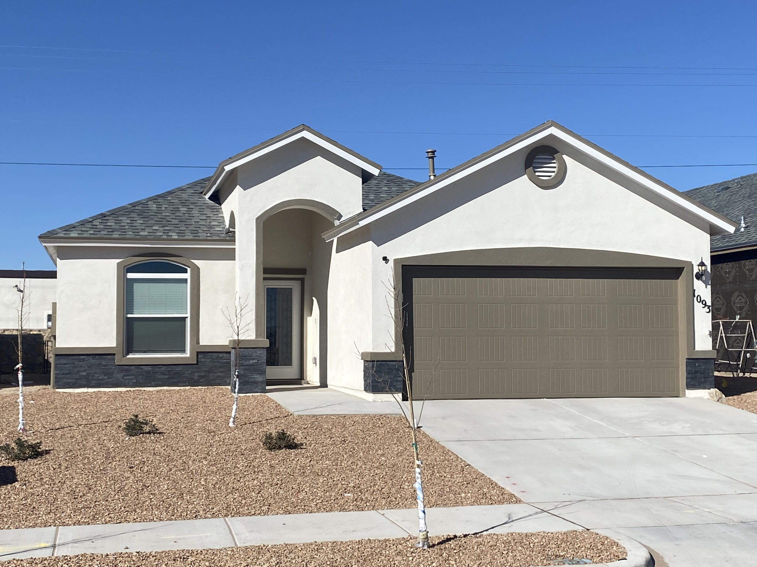 a front view of a house with yard