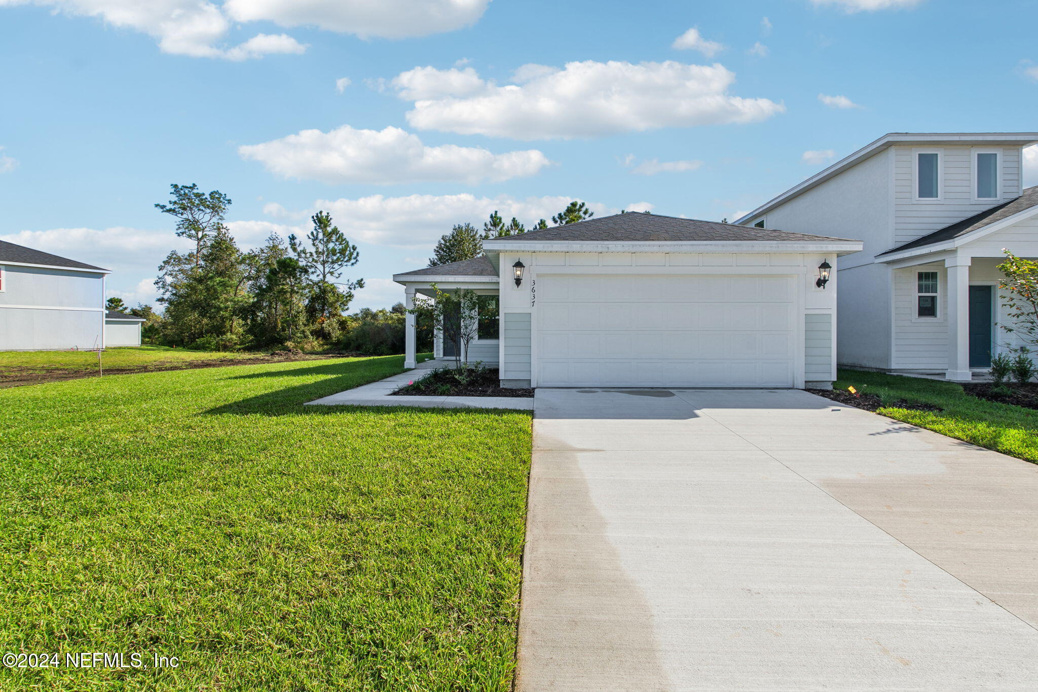 a front view of a house with yard