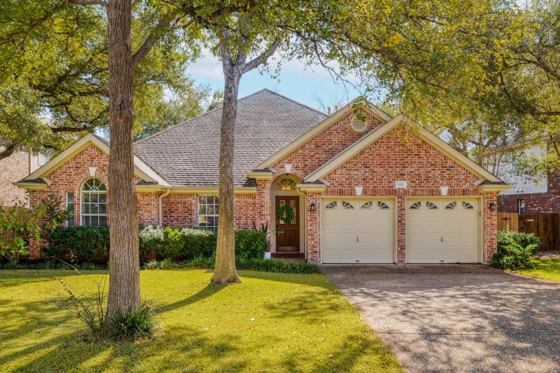 a view of a house with pool and yard