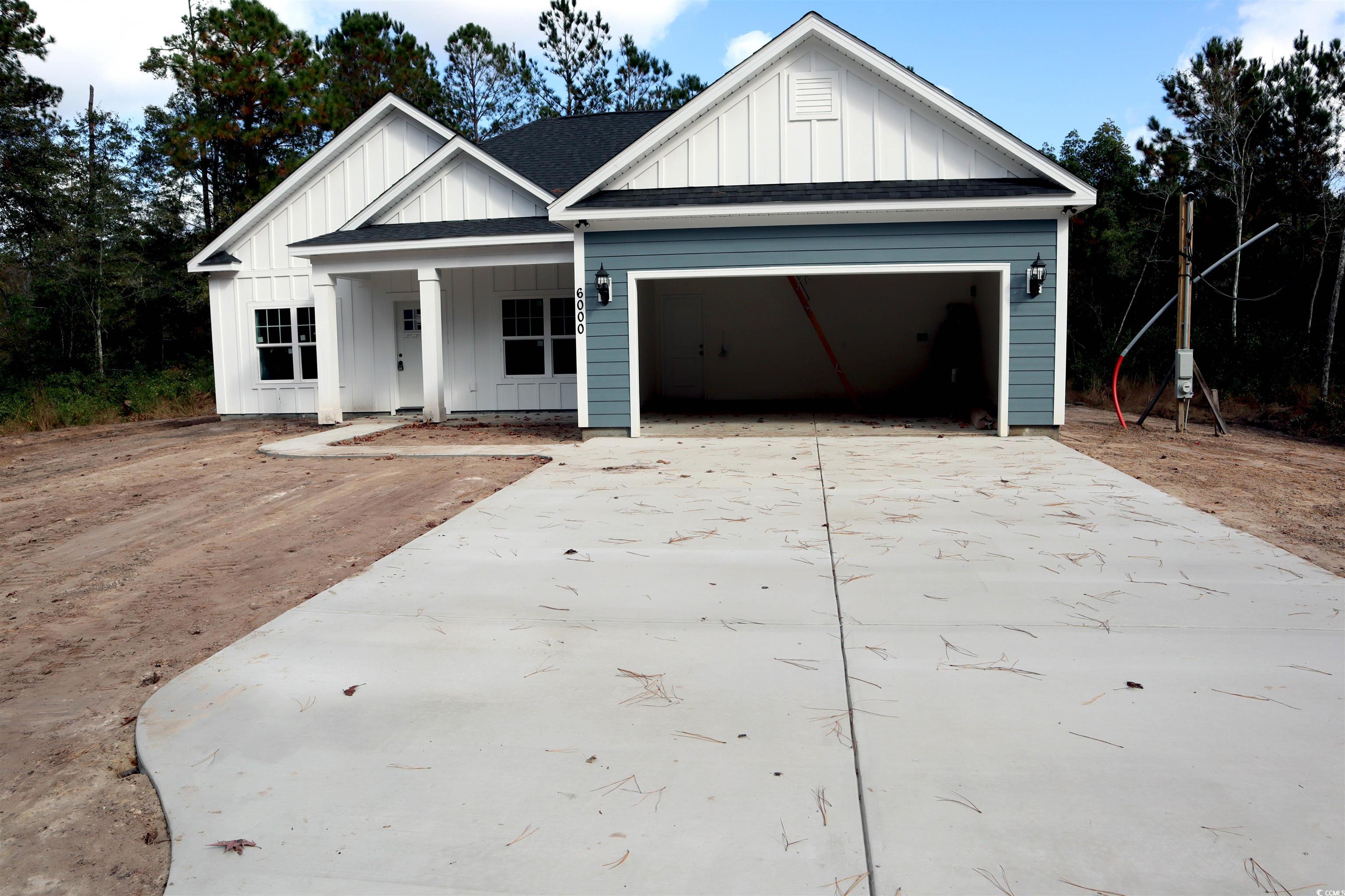 View of front of property with a garage