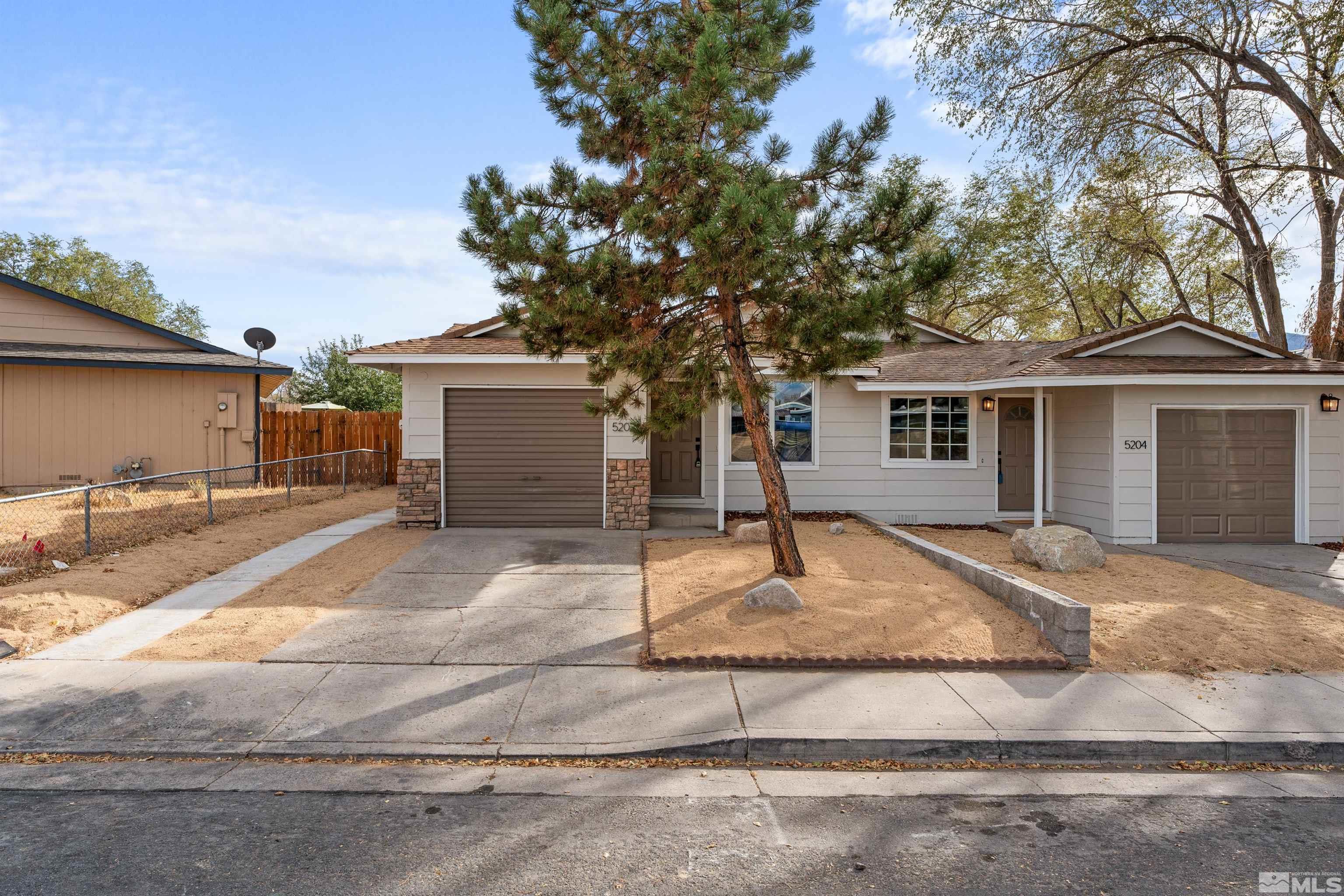 a house view with a backyard space