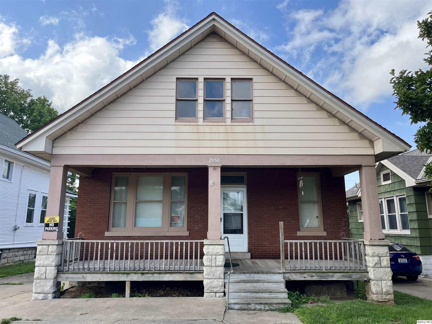 a view of a house with a yard and deck