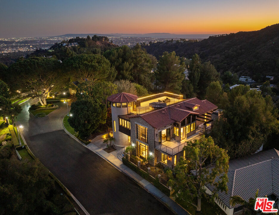 an aerial view of a house with a garden