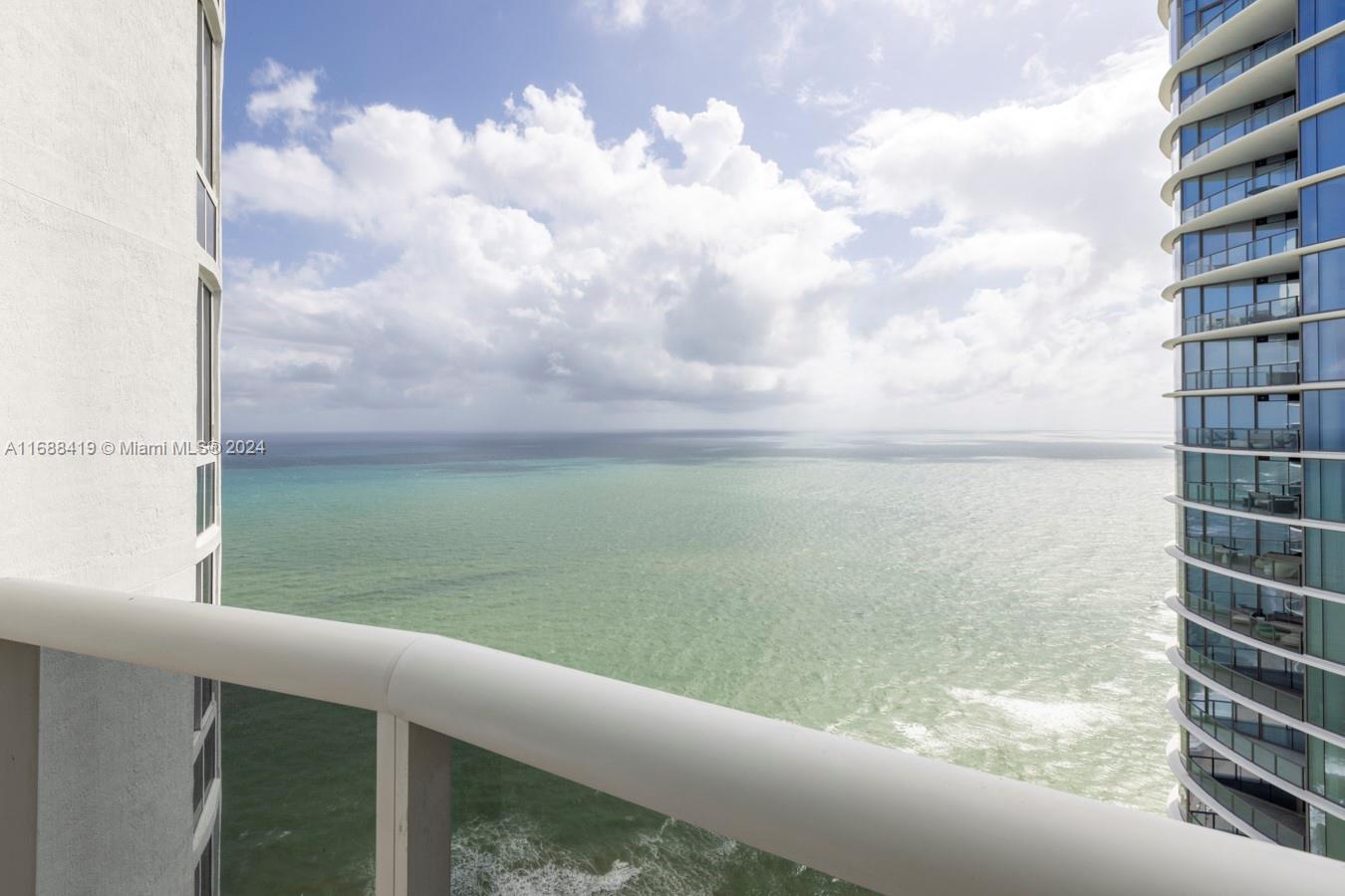 a view of a lake from a balcony