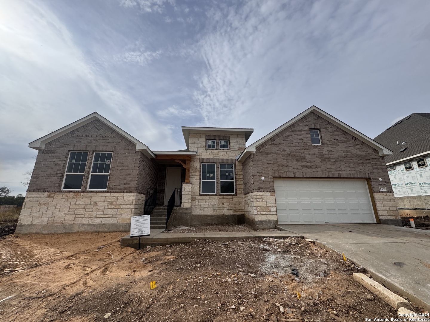 a front view of a house with garage