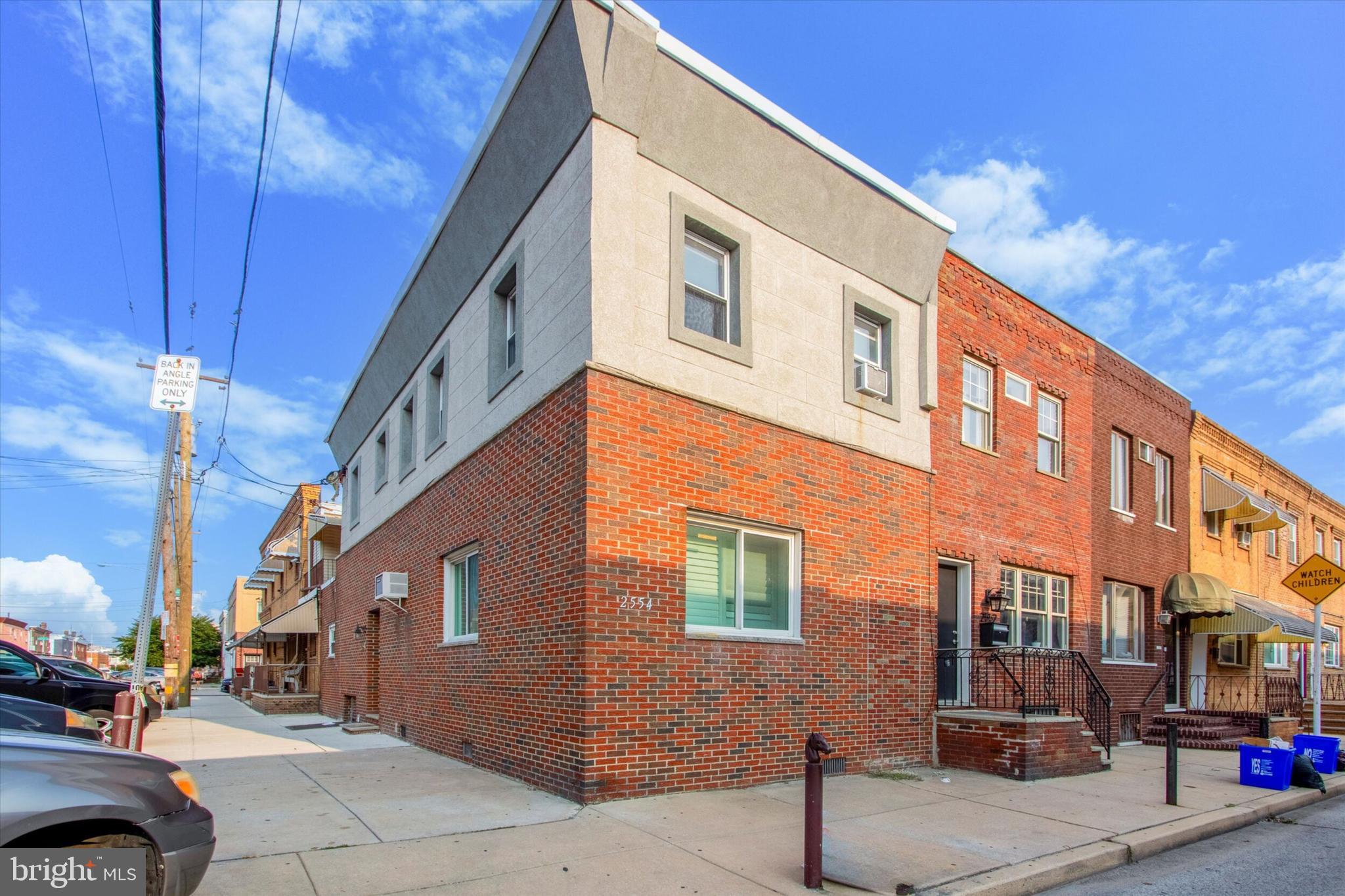 a front view of a building with street view