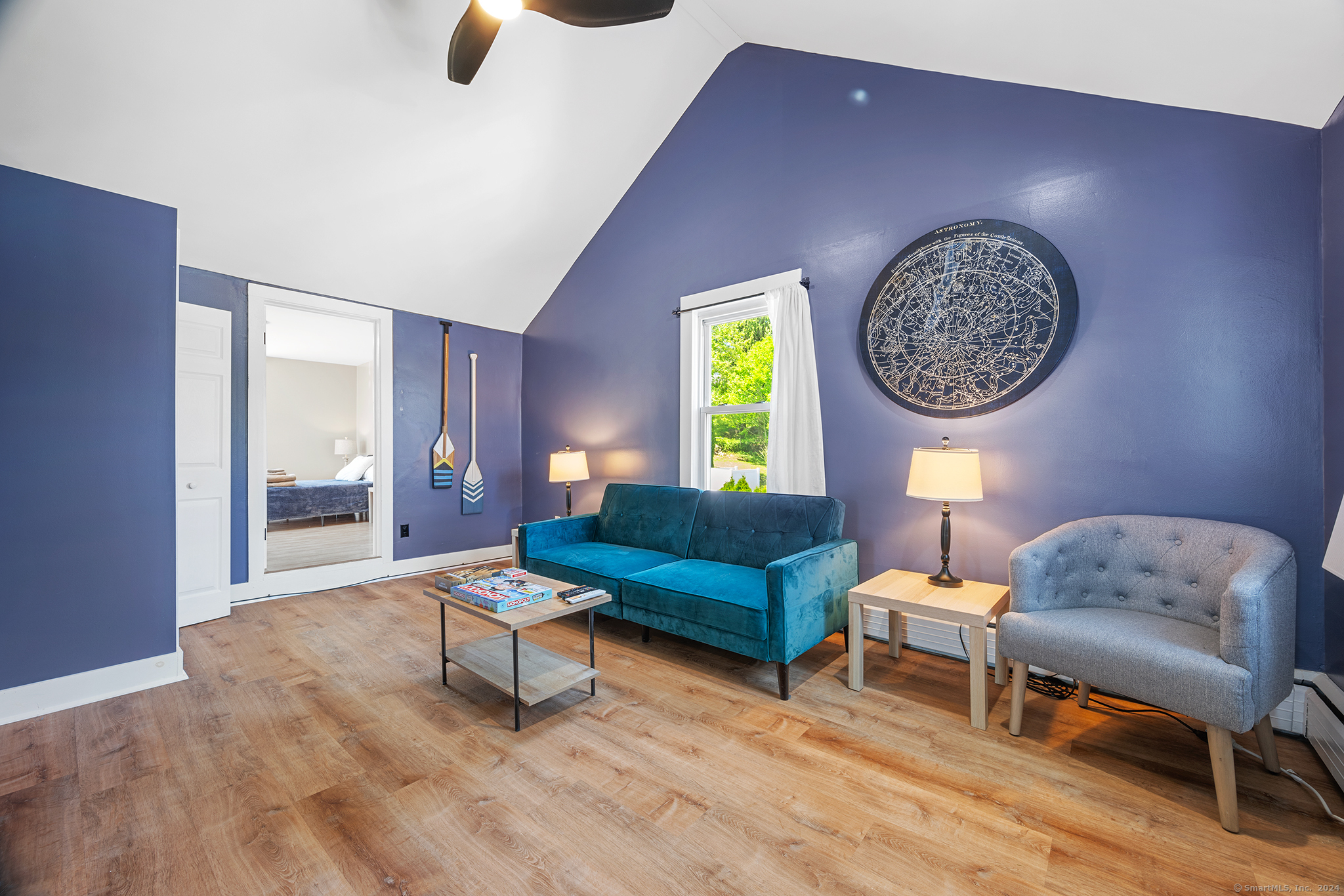 a living room with furniture and a window