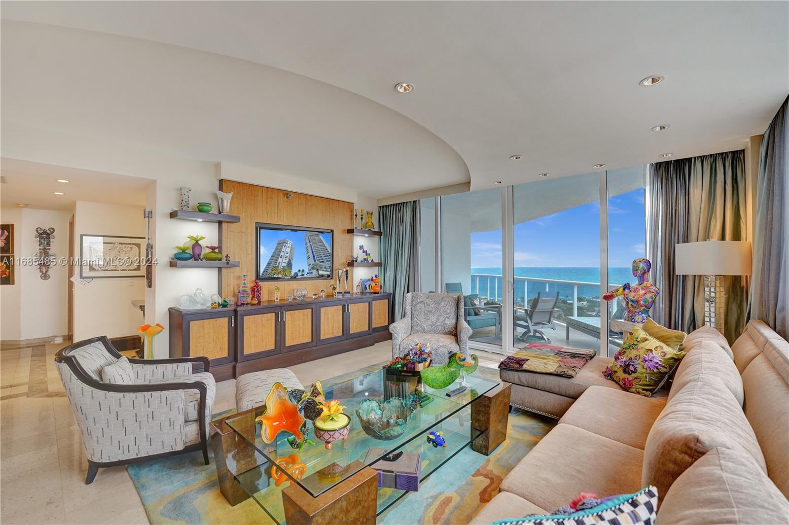 a living room with furniture fireplace and a window