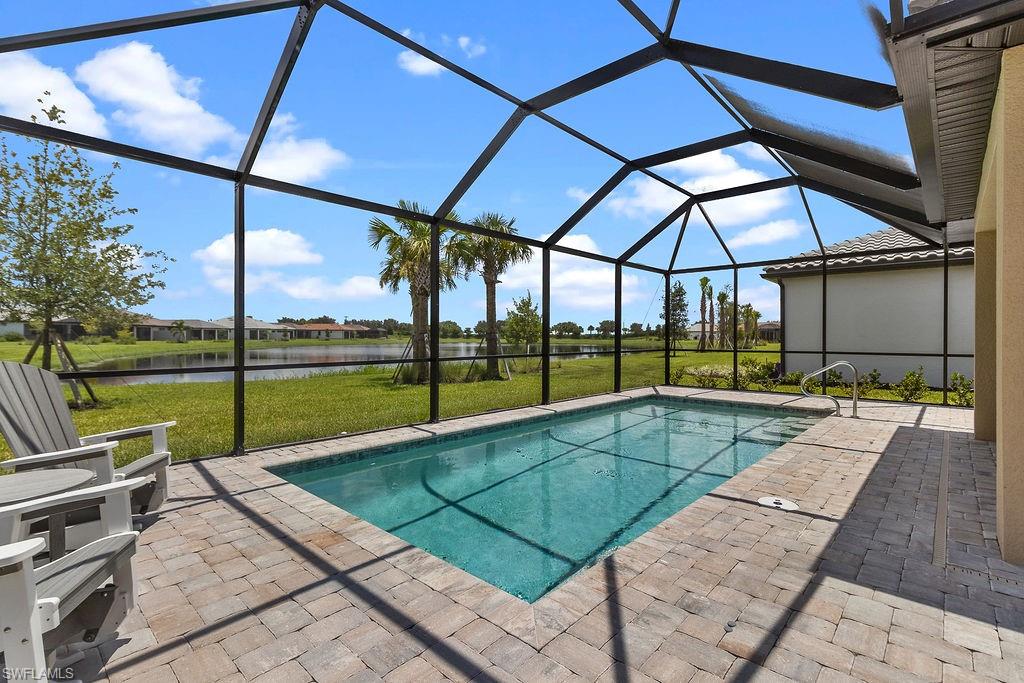 a view of a backyard with a swimming pool