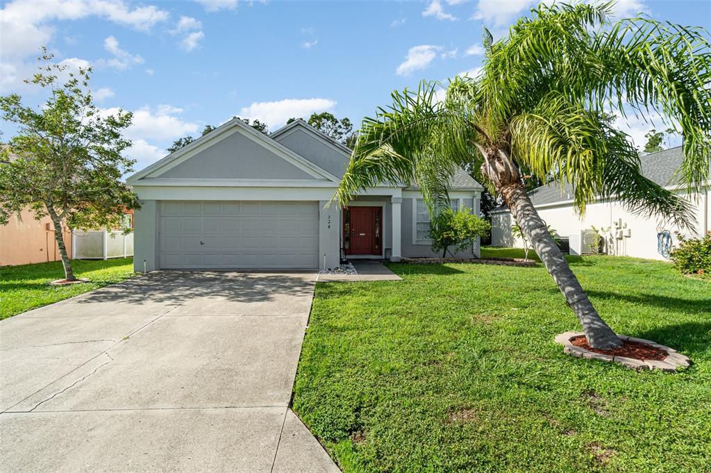 front view of a house with a yard