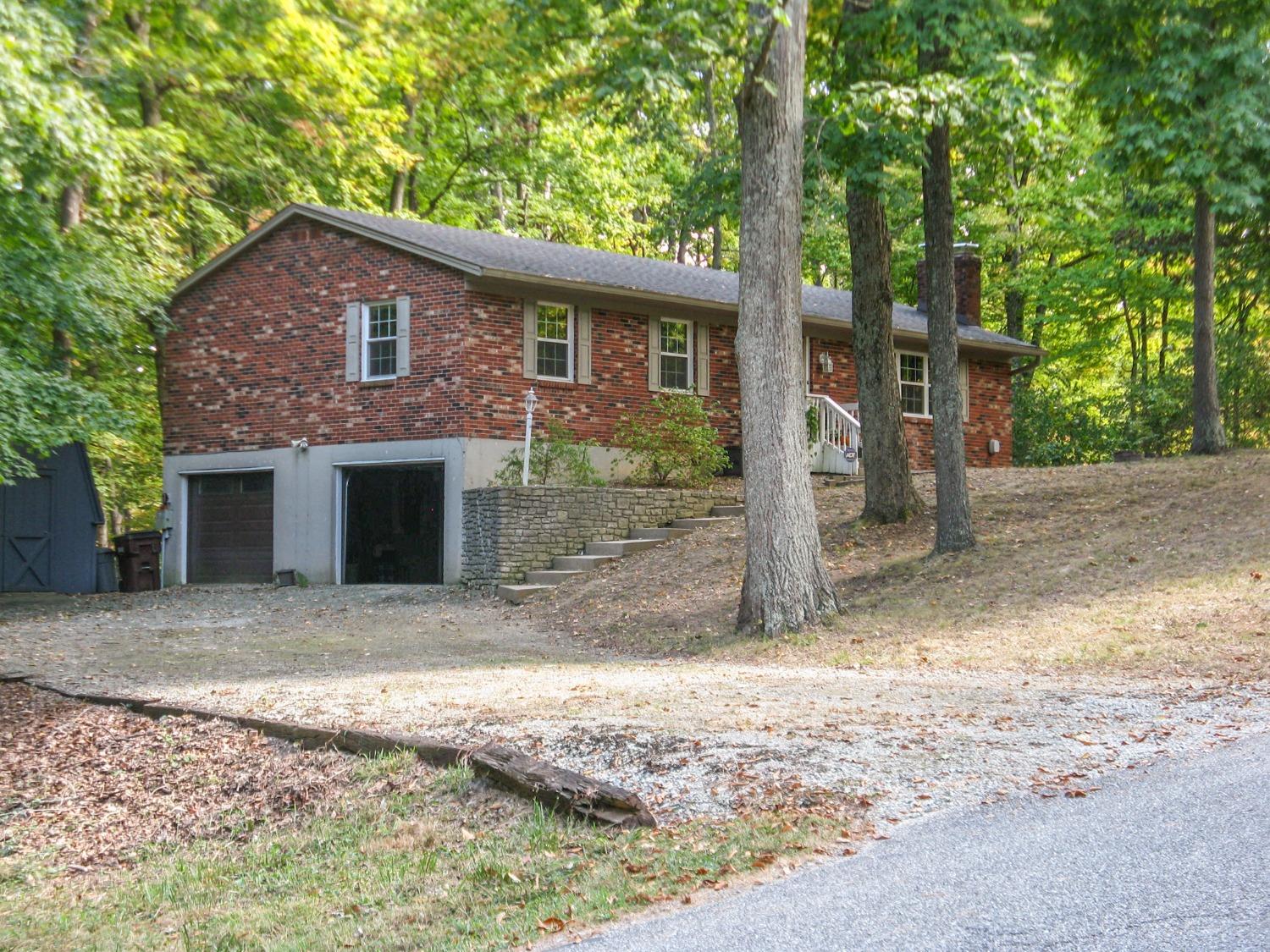 Welcome home to your own .76 acre heavily wooded retreat