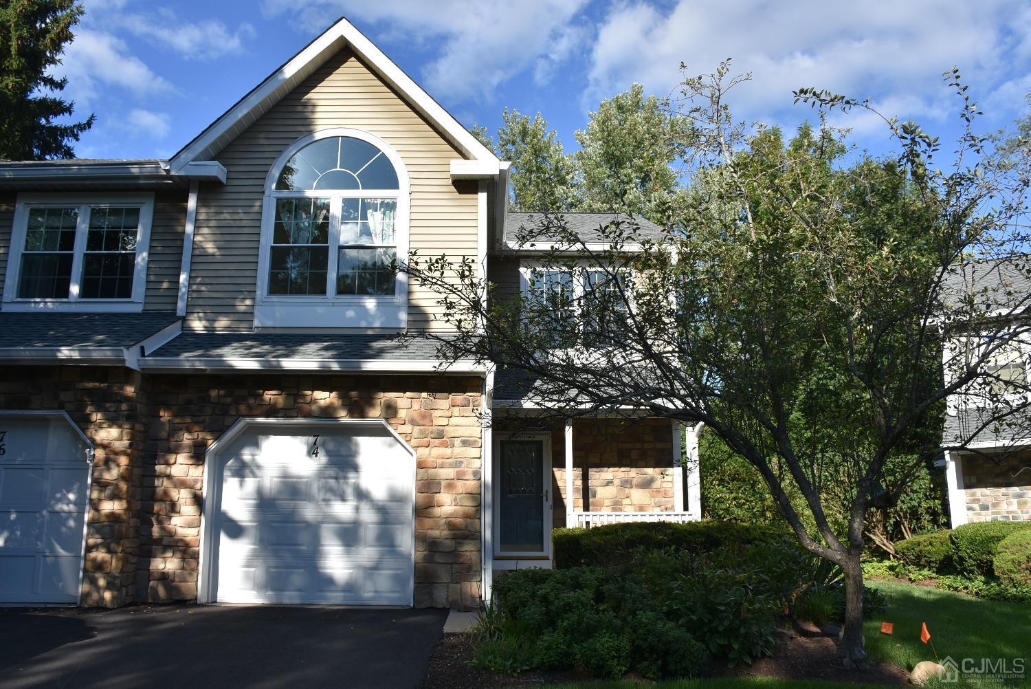 a front view of a house with yard