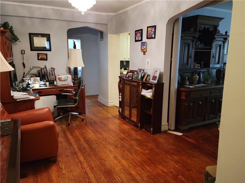 a view of a workspace with wooden floor