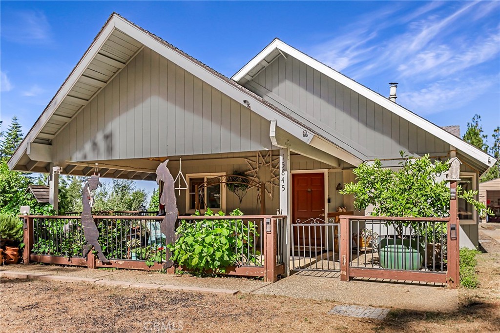 a view of a house with wooden fence